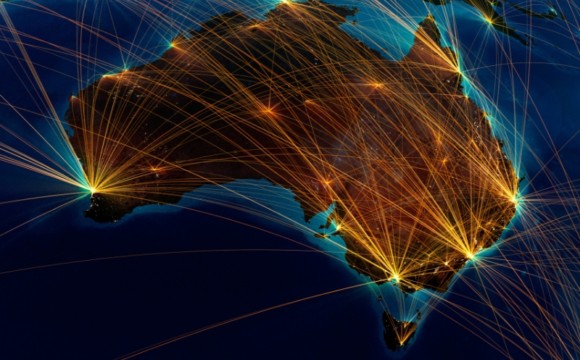View of Australia from space with golden lines linking airports and heading overseas
