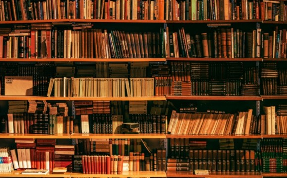 many books on bookshelves in a library