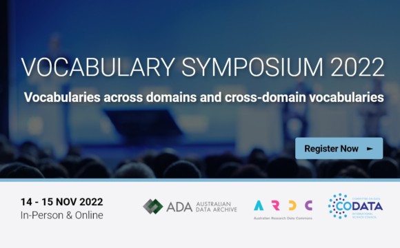 A banner showing a conference hall full of people. A person is speaking at the lectern with two people sitting on the stage. The banner text reads “Vocabulary Symposium 2022: Vocabularies across domains and cross-domain vocabularies, register now, 14 to 15 November 2022, in-person and online.” The banner shows the logos of the Australian Data Archive, the Australian Research Data Commons, and CO DATA, the International Science Council Committee on Data.