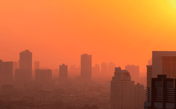The skyline of a city in smog at dawn or dusk