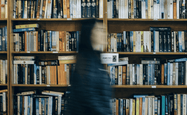 Researcher moving in a library
