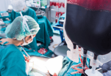 bag of blood being used in an operating theatre in a hospital