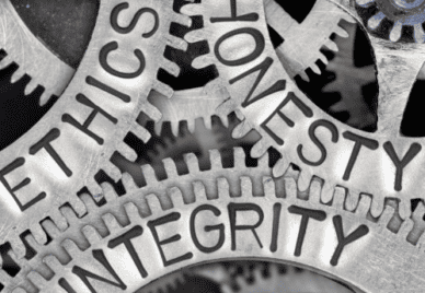 A set of gears engraved the words "ethics", "honesty" and "integrity"