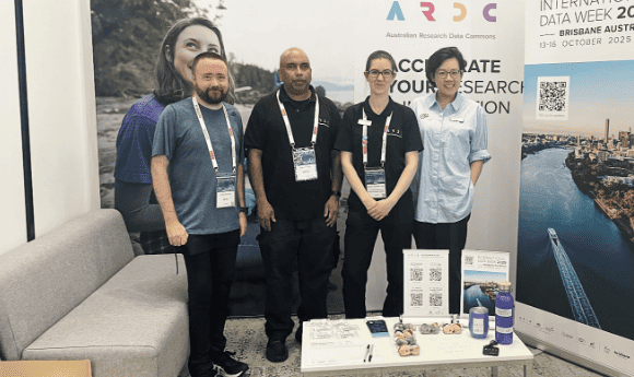 4 ARDC staff stand at the ARDC booth as Supercomputing Asia 2024 in Sydney